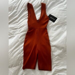 PrettyLittleThing Ribbed Deep V Jumpsuit in Rust Orange